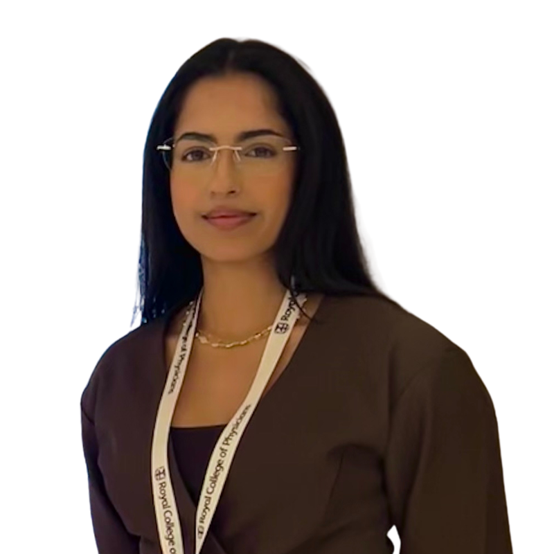 Woman wearing glasses and a lanyard with a plain background